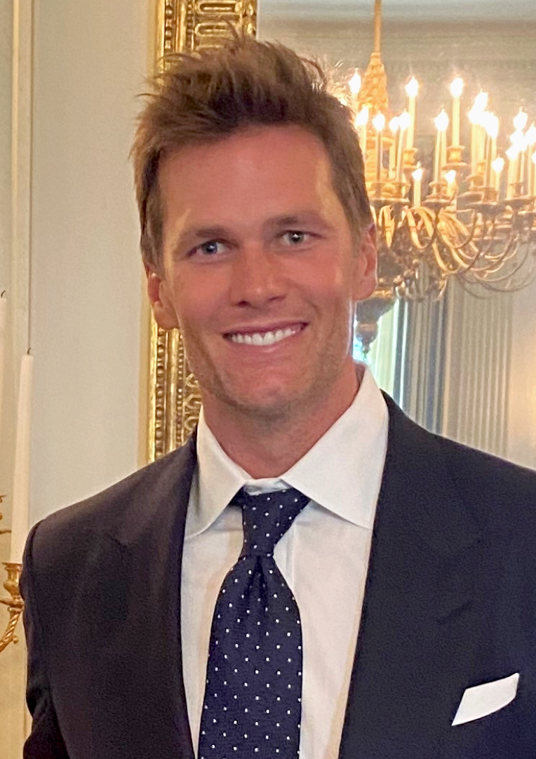 Congressman Charlie Crist • Public domain: Tom Brady, former NFL quarterback, at an event in 2021 : Source https://twitter.com/RepCharlieCrist/status/1417539213168418816/photo/1