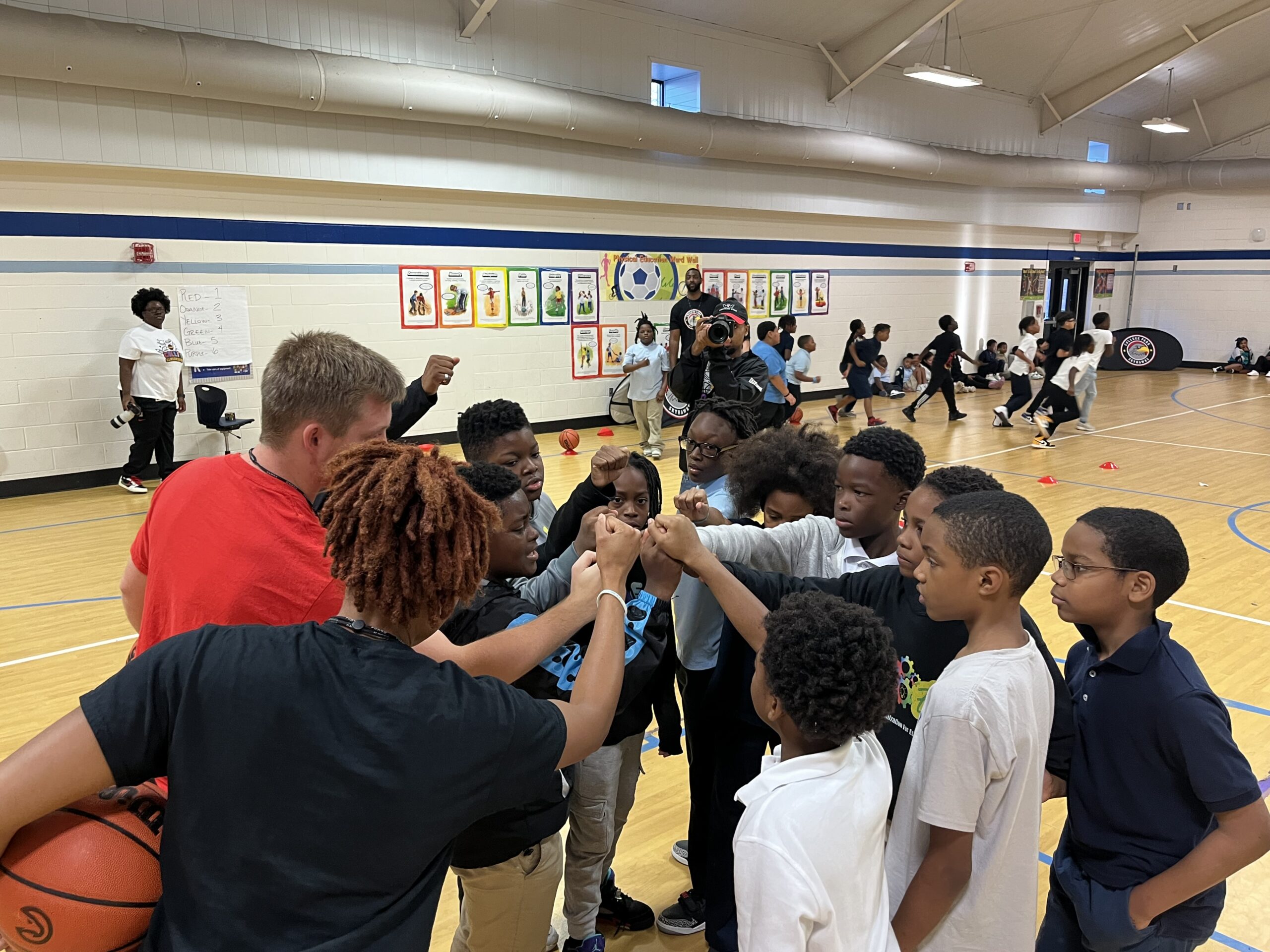 Photo courtesy of COLLEGE PARK SKYHAWKS; Back to Basketball’ and the school supply donation in partnership with CareSource at West Clayton Elementary