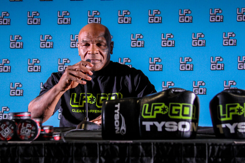 Mike Tyson in action, unveiling LF*GO! and offering a glimpse into his intense training for the upcoming fight.