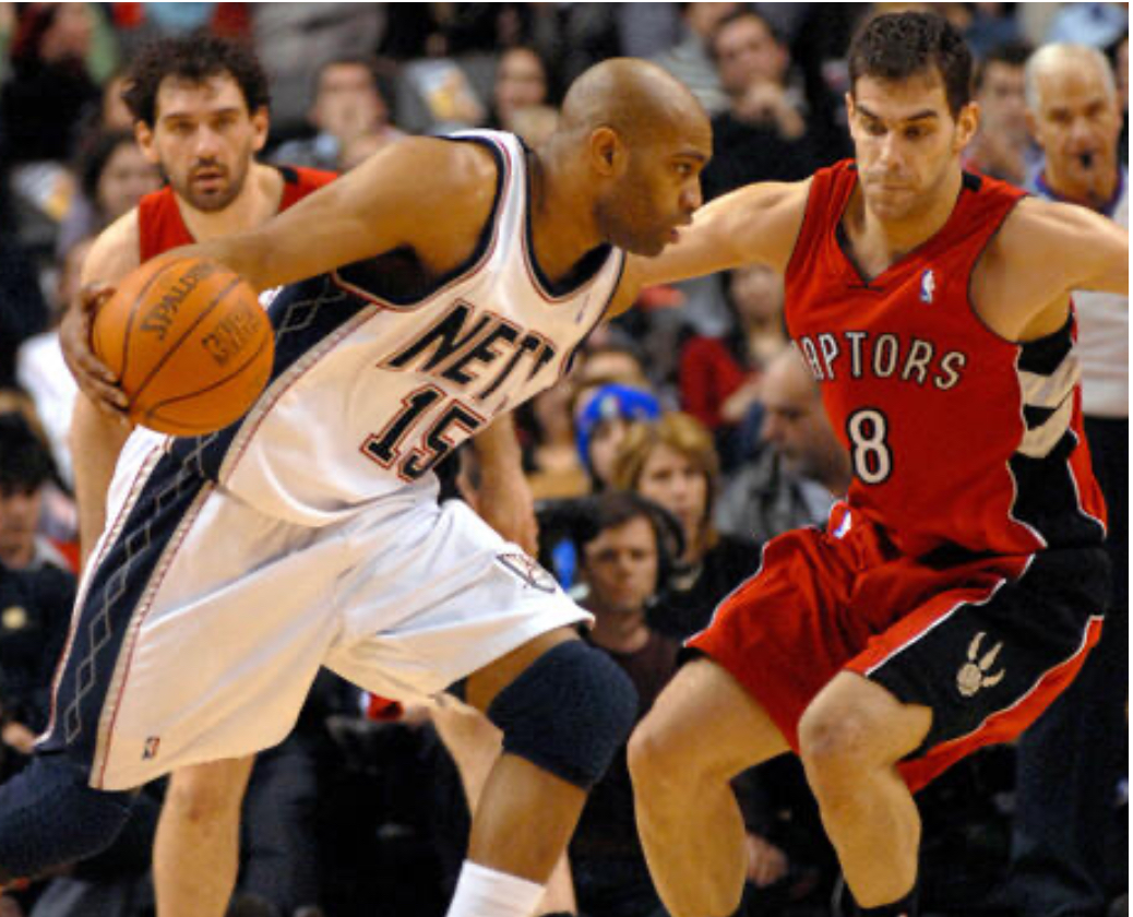 New Jersey Nets' Vince Carter drives the ball past Toronto Raptors' Jose Calderon of Spain during second quarter action at the Air Canada Center in Toronto, Canada on February 14, 2007. The Raptors defeated the Nets 120-109. (UPI Photo/Christine Chew)